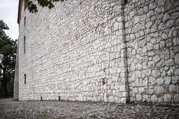 The wall of large old building. Stone wall of large old building