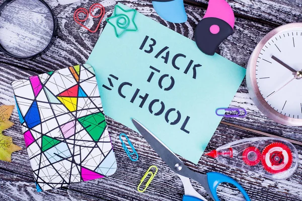 Back to school and stationery close-up. School stationery on wooden background. Soon to study