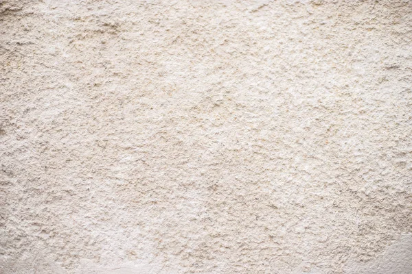 Beige background of plaster. Texture of beige shabby stucco