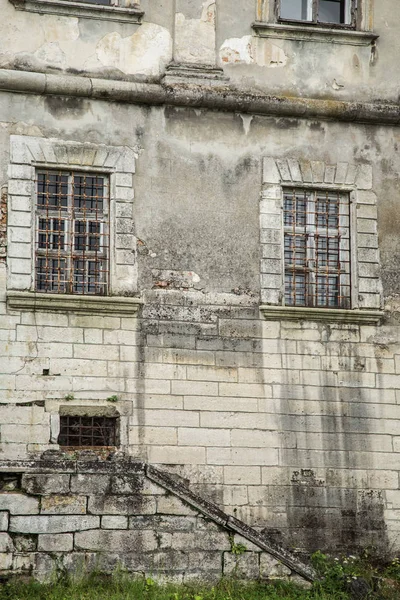 Part with windows of ancient castle. Windows of old dilapidated castle. Lviv, Ukraine, Pidhirtsi Castle