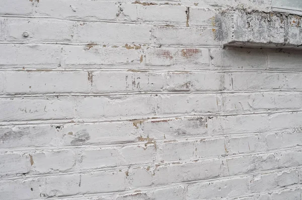 White brick wall with window sill. Beautiful background of white brick