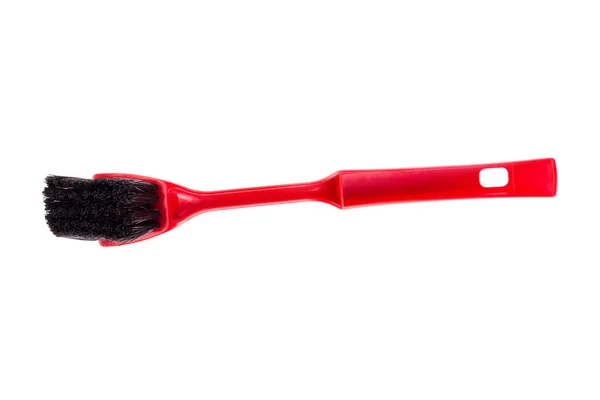 Red brush to clean the dirt isolate. Cleaning brush on white background
