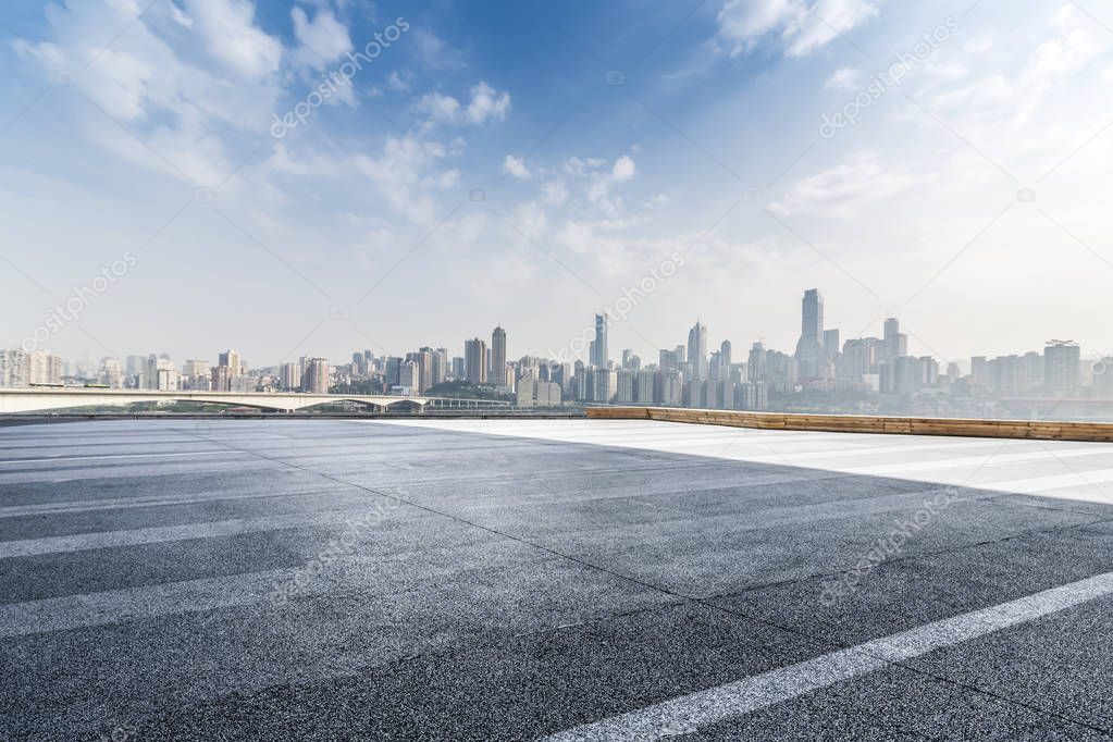 Panoramic skyline and modern business office buildings with empty road,empty concrete square floor