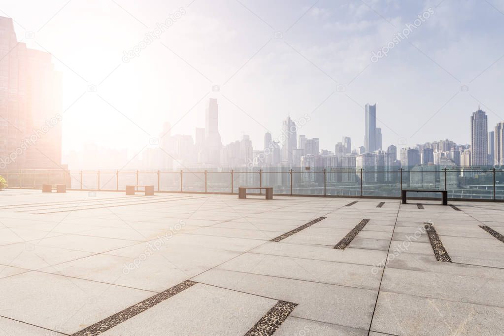 Panoramic skyline and modern business office buildings with empty road,empty concrete square floor