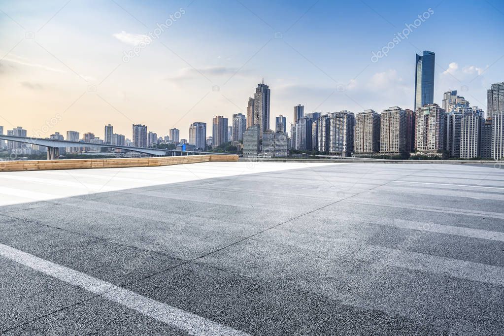 Panoramic skyline and modern business office buildings with empty road,empty concrete square floor