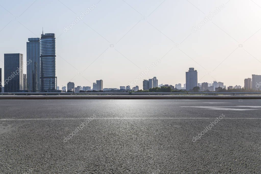 Panoramic skyline and modern business office buildings with empty road,empty concrete square floor