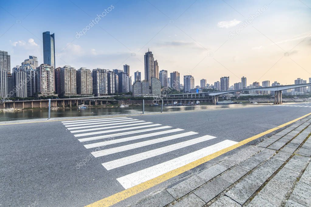 Panoramic skyline and modern business office buildings with empty road,empty concrete square floor