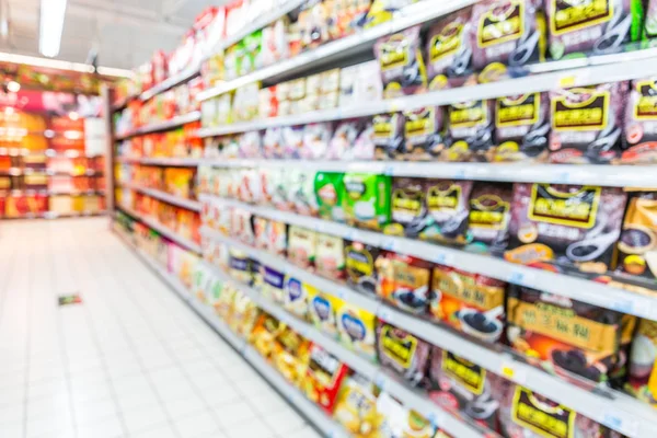 Abstract Blurred Supermarket Aisle Colorful Shelves Unrecognizable Customers Background — Stock Photo, Image