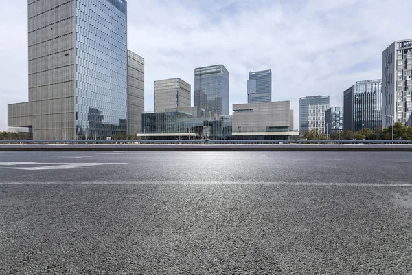 Empty Road with modern business office building,empty floor