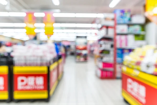 Abstract Blurred Supermarket Aisle Colorful Shelves Unrecognizable Customers Background — Stock Photo, Image