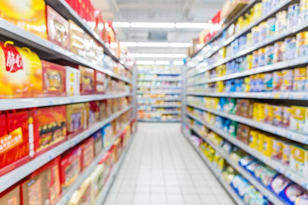 Abstract Blurred Supermarket Aisle Colorful Shelves Unrecognizable Customers Background — Stock Photo, Image