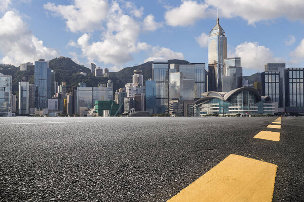Panoramic skyline and buildings with empty road