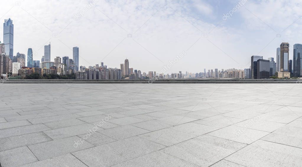 Panoramic skyline and buildings with empty concrete square floorchongqing citychina