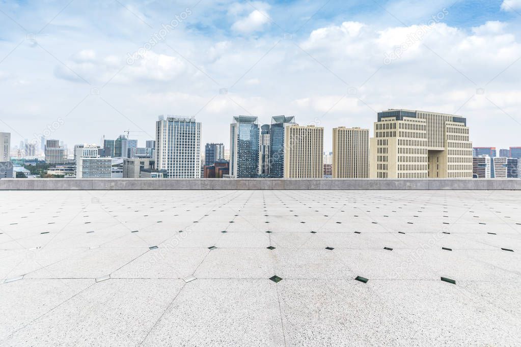 Panoramic skyline and modern business office buildings with empty road,empty concrete square floor