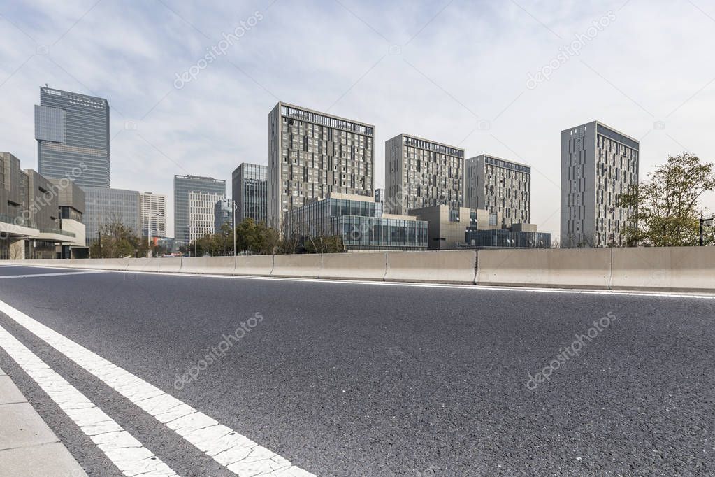 Panoramic skyline and modern business office buildings with empty road,empty concrete square floor