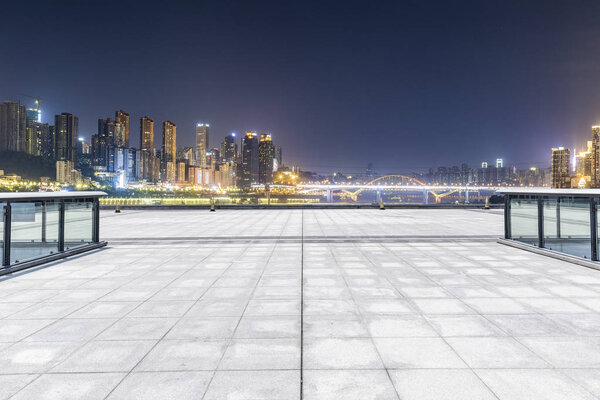 Panoramic skyline and buildings with empty roadchongqing city at night