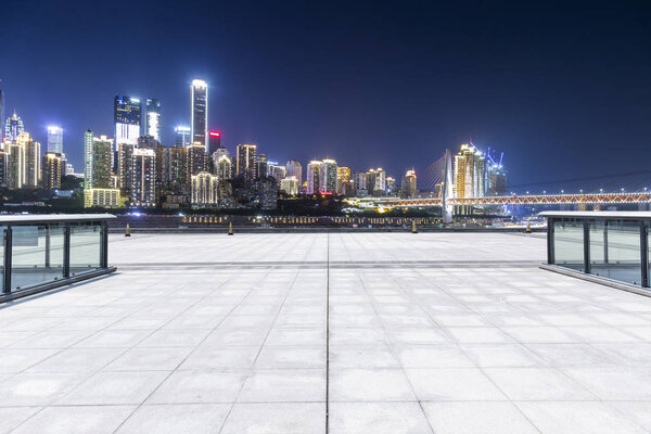 Panoramic skyline and buildings with empty roadchongqing city at night