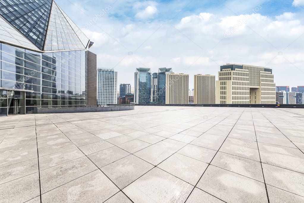 Panoramic skyline and modern business office buildings with empty road,empty concrete square floor