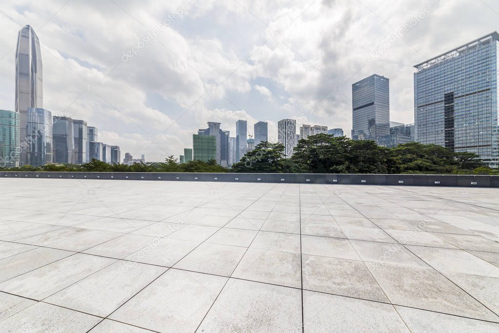 Panoramic skyline and modern business office buildings with empty road,empty concrete square floor