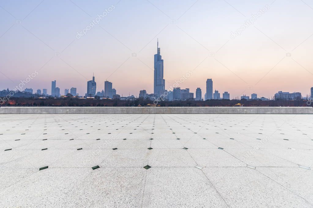 Panoramic skyline and modern business office buildings with empty road,empty concrete square floor