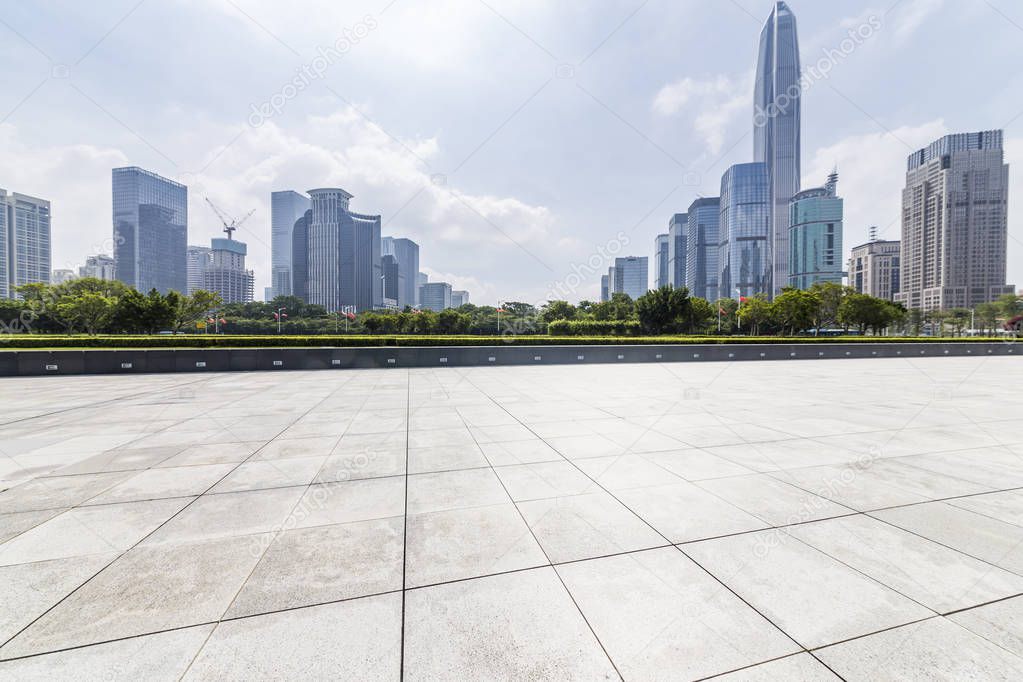 Panoramic skyline and modern business office buildings with empty road,empty concrete square floor