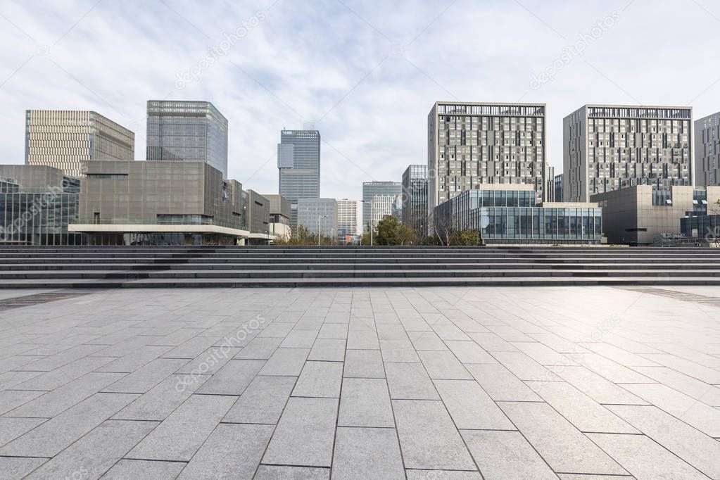 Panoramic skyline and modern business office buildings with empty road,empty concrete square floor