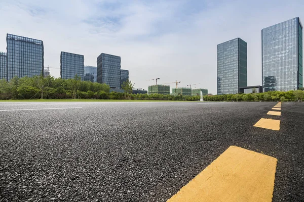 stock image Panoramic skyline and modern business office buildings with empty road,empty concrete square floor