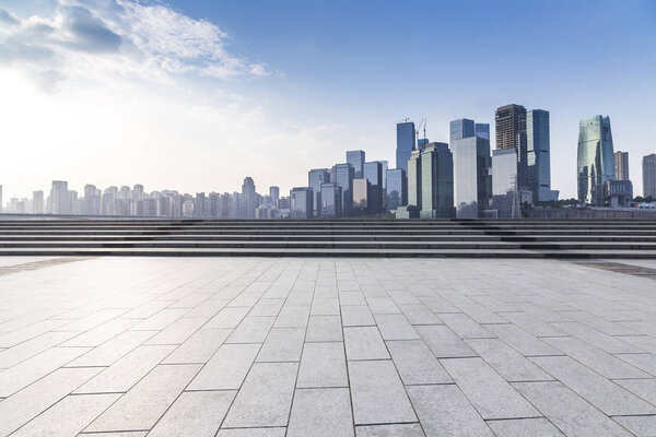 Panoramic skyline and modern business office buildings with empty road,empty concrete square floor