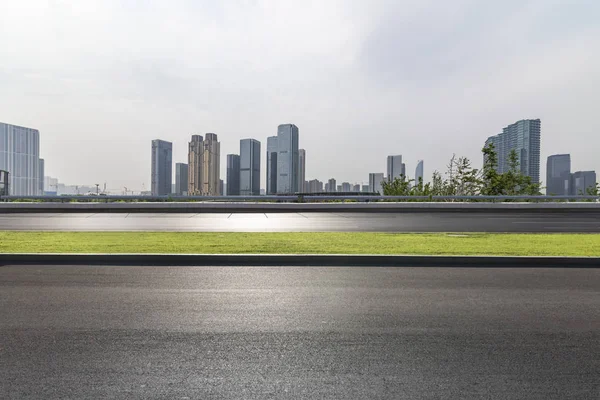 stock image Panoramic skyline and modern business office buildings with empty road,empty concrete square floor