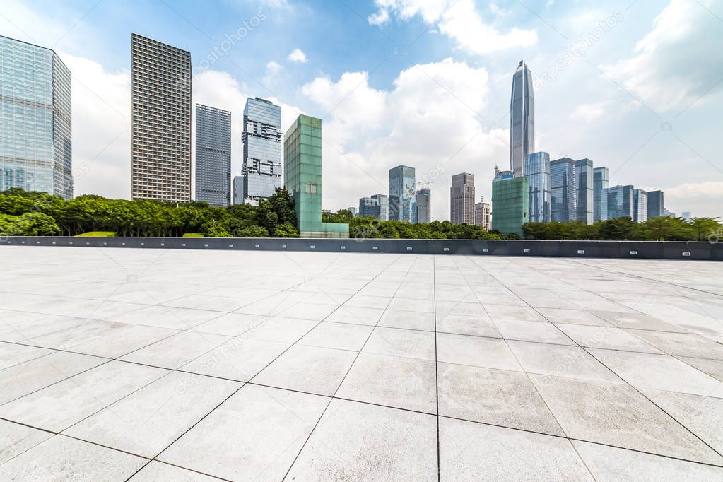 Panoramic skyline and modern business office buildings with empty road,empty concrete square floor