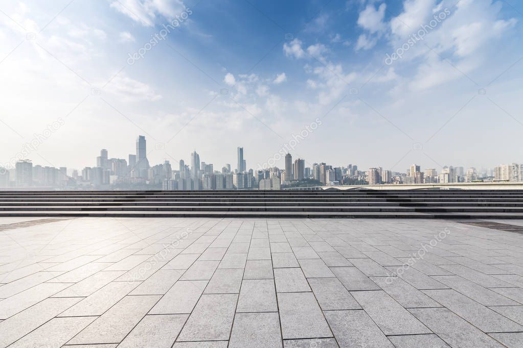 Panoramic skyline and modern business office buildings with empty road,empty concrete square floor