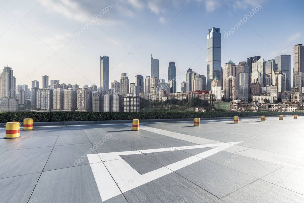 Panoramic skyline and modern business office buildings with empty road,empty concrete square floor