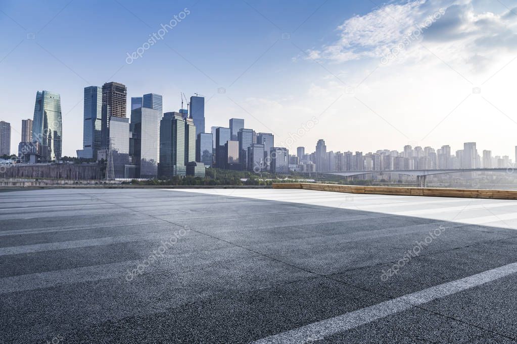 Panoramic skyline and modern business office buildings with empty road,empty concrete square floor