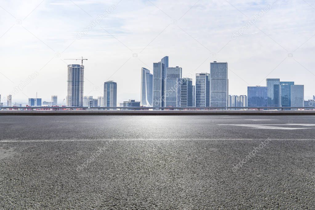 Panoramic skyline and modern business office buildings with empty road,empty concrete square floor