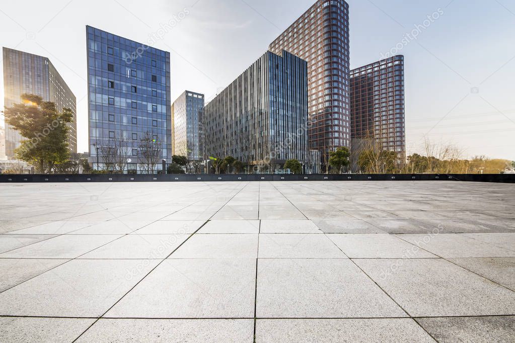 Panoramic skyline and modern business office buildings with empty road,empty concrete square floor