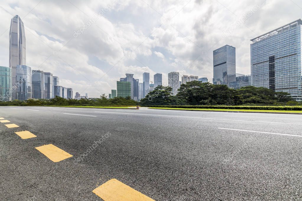 Panoramic skyline and modern business office buildings with empty road,empty concrete square floor