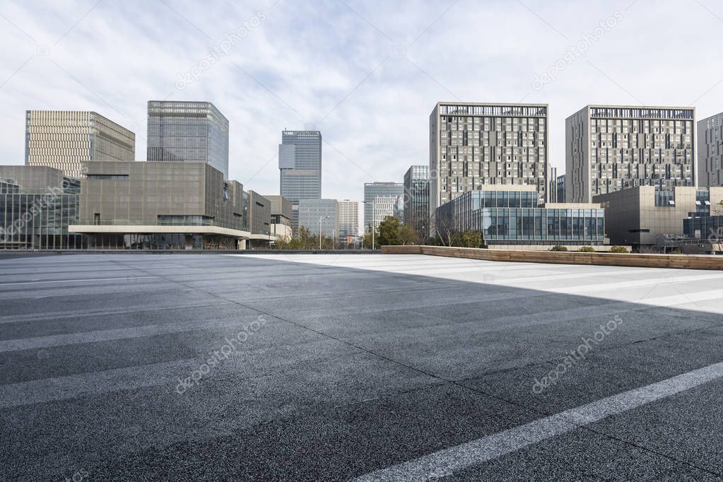 Panoramic skyline and modern business office buildings with empty road,empty concrete square floor