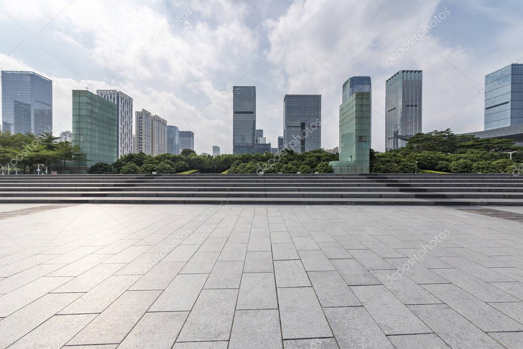 Panoramic skyline and modern business office buildings with empty road,empty concrete square floor