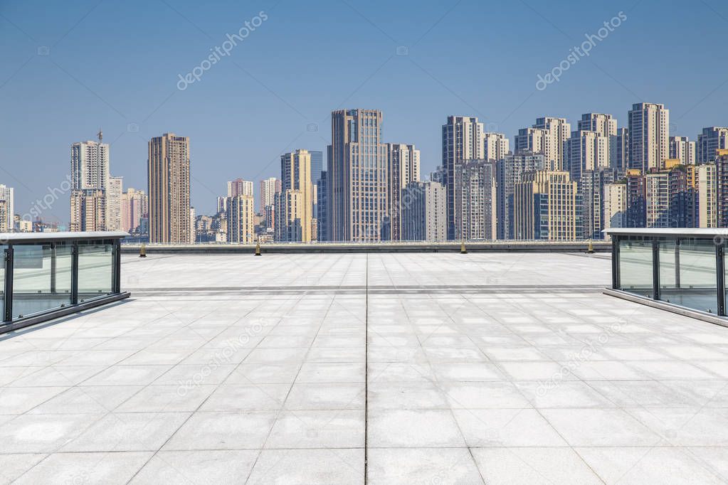 Panoramic skyline and modern business office buildings with empty road,empty concrete square floor