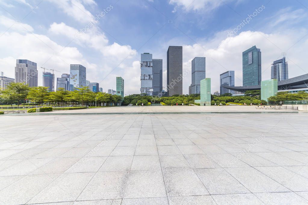 Panoramic skyline and modern business office buildings with empty road,empty concrete square floor