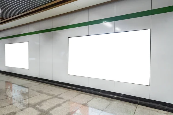 Blank advertising display in subway station underpass public are