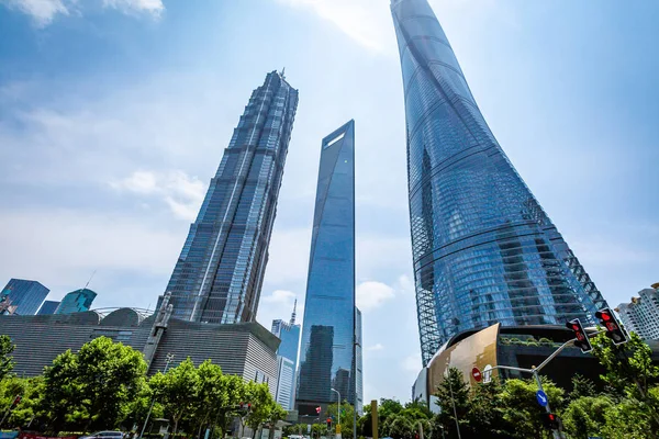 Bottom view of modern skyscrapers in business district against b — Stock Photo, Image