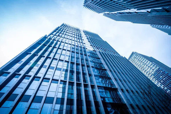 Bottom view of modern skyscrapers in business district against b Royalty Free Stock Photos