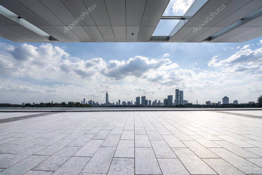 Panoramic skyline and modern business office buildings with empty road