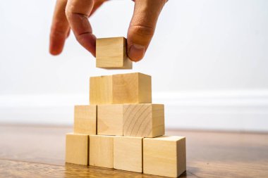 close-up view of wooden blocks on light background