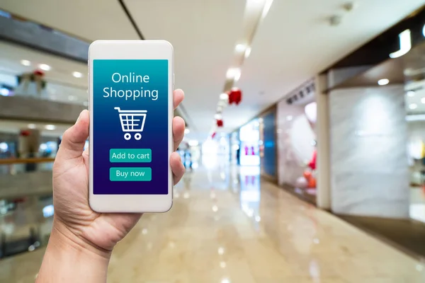 Smart phone online shopping in woman hand. Shopping center in ba — Stock Photo, Image