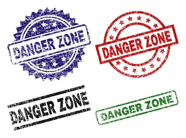 Grunge texturizado DANGER ZONE selos — Vetor de Stock