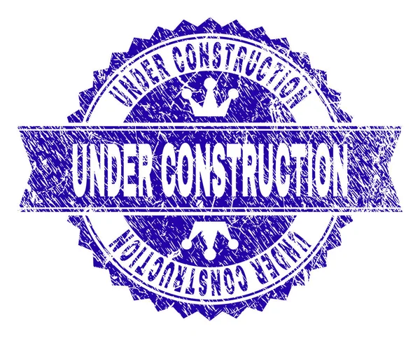 ตราประทับตราประทับตรา UNDER CONSTRUCTION ด้วยริบบิ้น — ภาพเวกเตอร์สต็อก