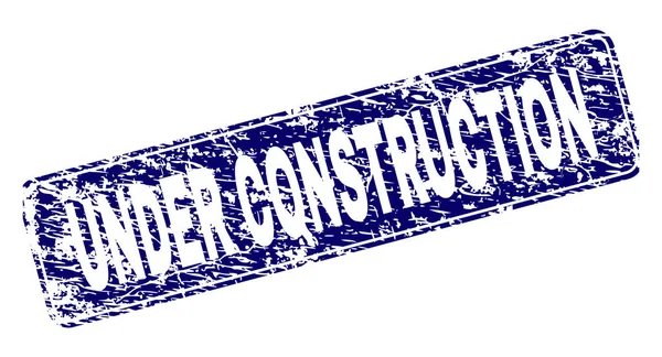 Grunge UNDER CONSTRUCTION กรอบสี่เหลี่ยมผืนผ้า — ภาพเวกเตอร์สต็อก