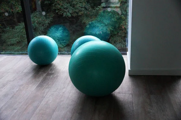 fitness balls by the window in the gym close-up